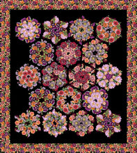 Fabric by Clothworks, Tina's Garden line. Quilt with floral hexagons separated by black background. Floral border.