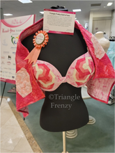 BraHaHa pink bra with Triangle Frenzy designs and a quilt