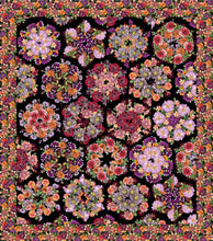 Fabric by Clothworks, Tina's Garden line. Quilt with floral hexagons separated by black background. Floral border.
